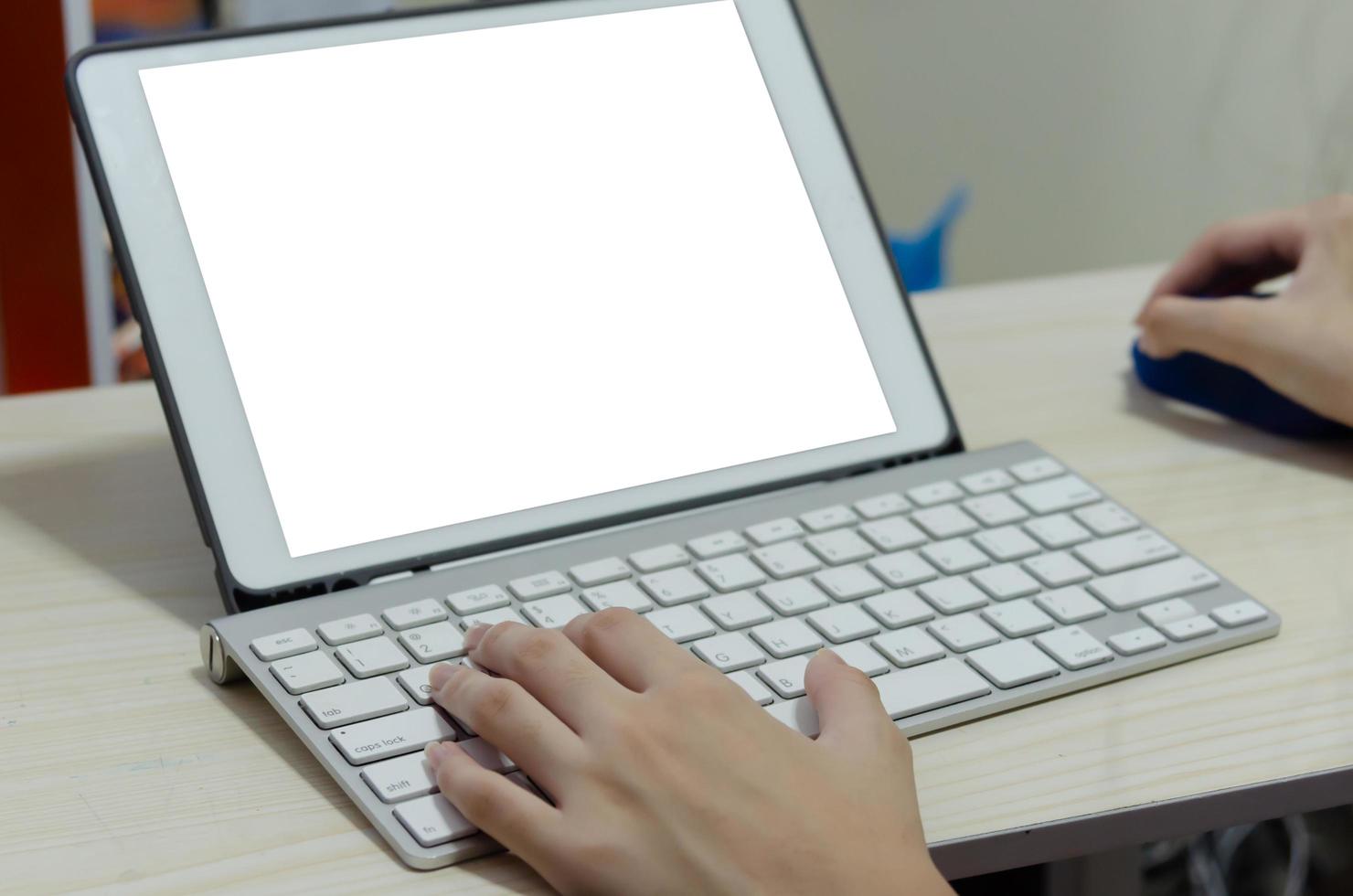 A girl using a computer keyboard. Studying online at home photo