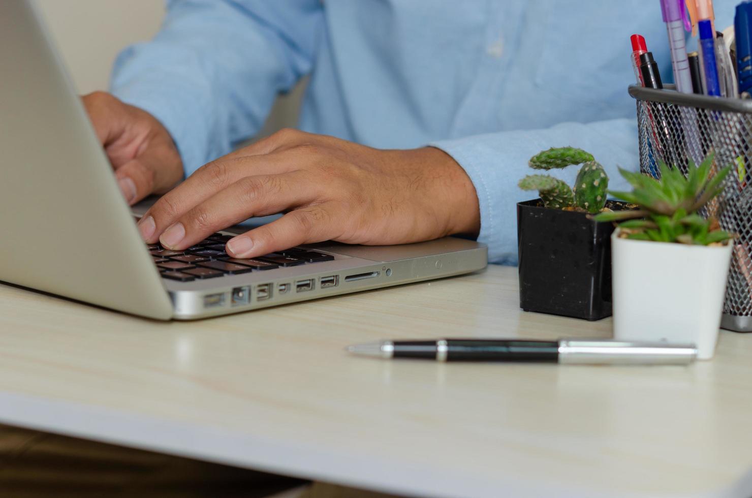 A businessman using a computer to find information photo