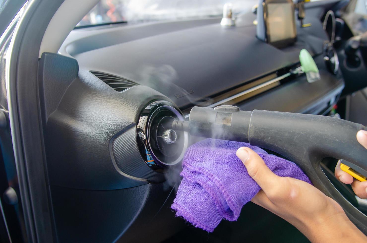 Cleaning the air conditioner of a car photo