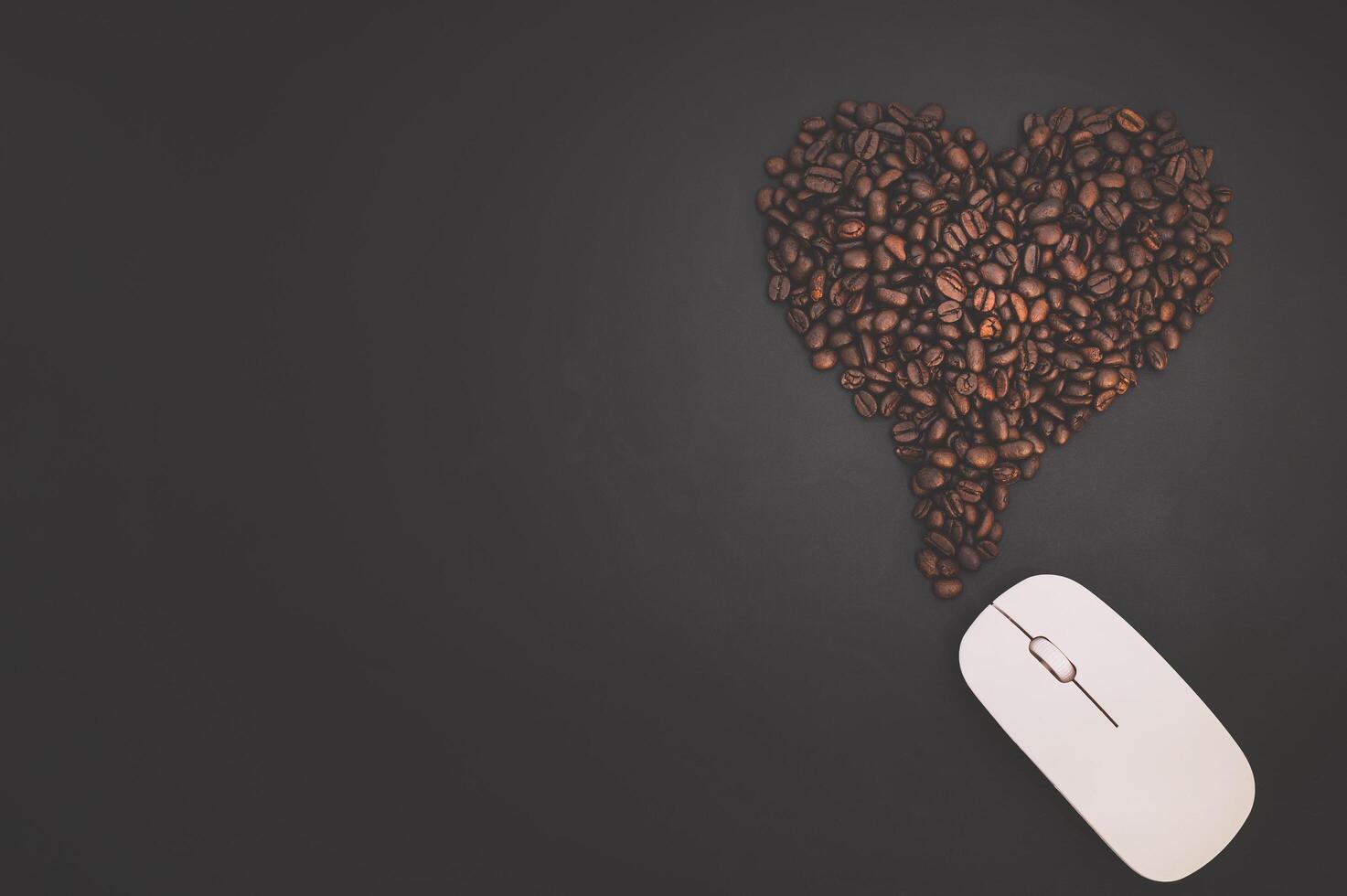 Coffee beans and computer mouse 2008486 Stock Photo at Vecteezy