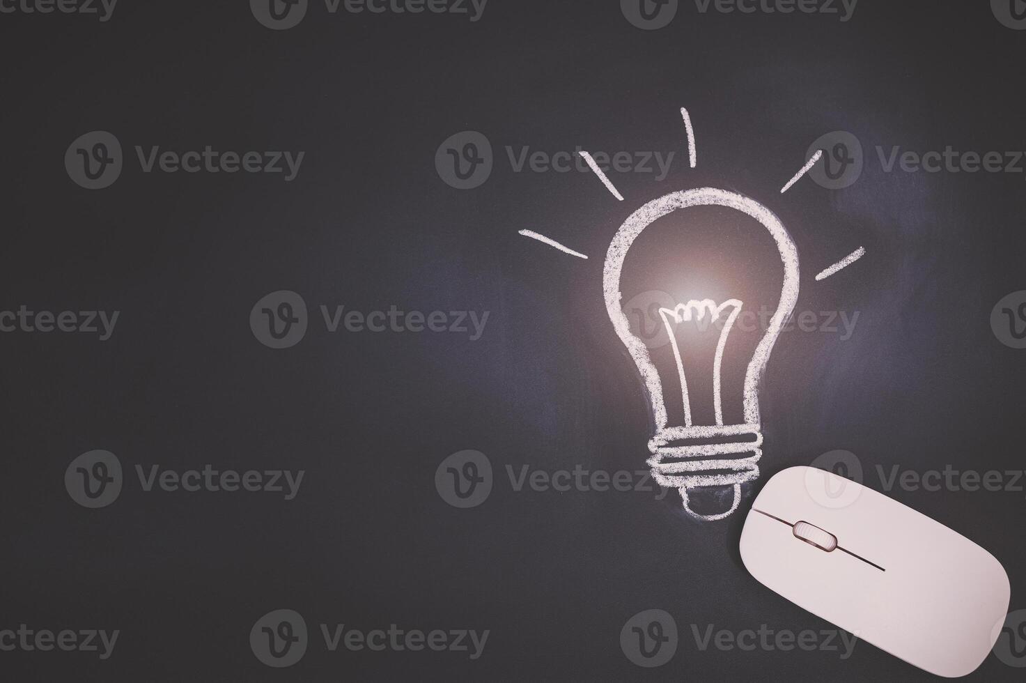 A computer mouse with a light bulb on it photo