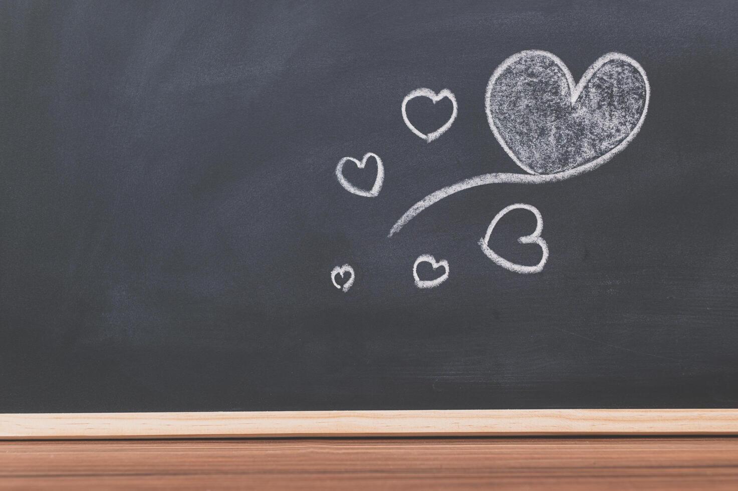 Heart doodles on the blackboard photo