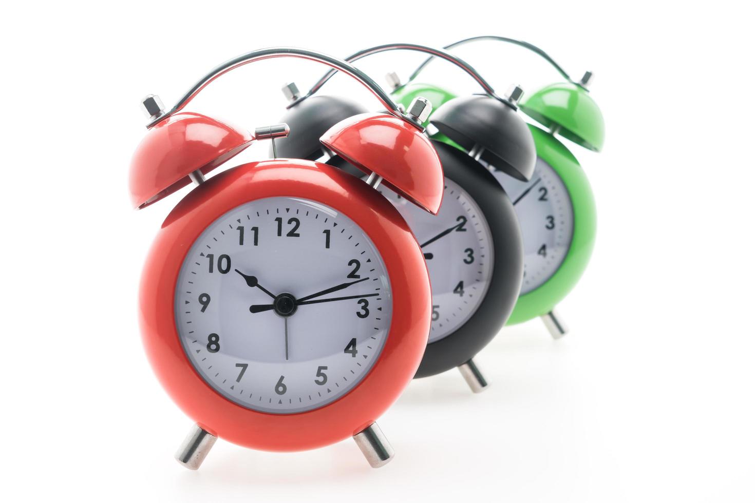 Alarm clocks on white background photo