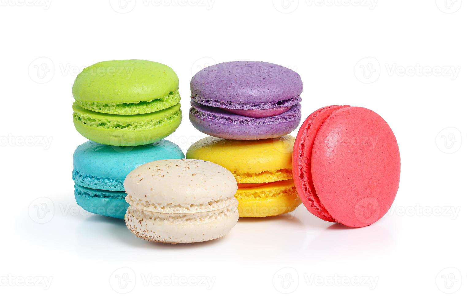 Colorful macarons on white background photo