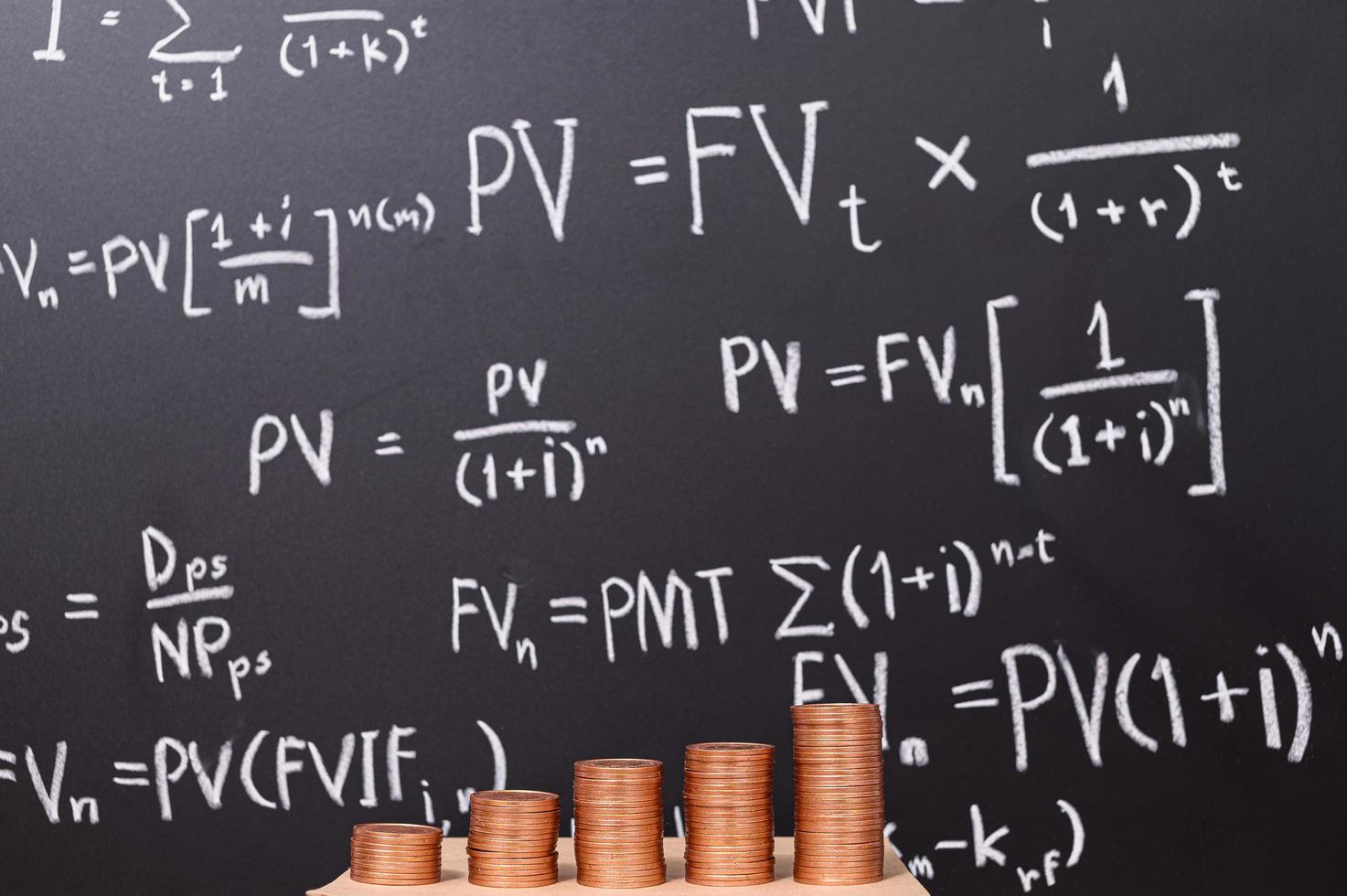 Coins in front of a blackboard photo