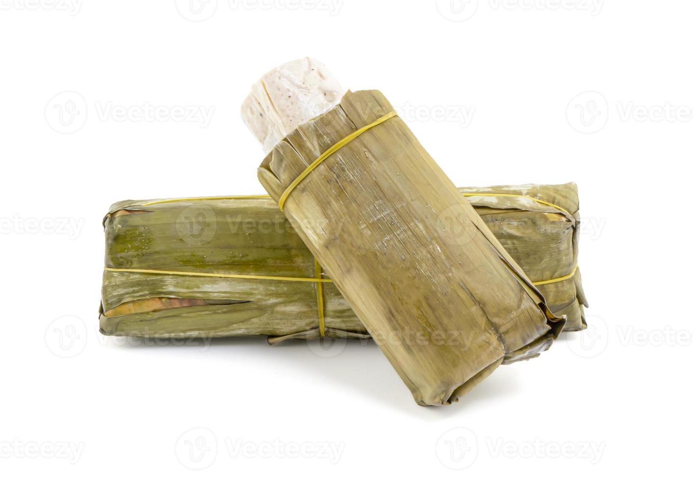 Pork sausage, or moo yor, wrapped in banana leaves on white background photo