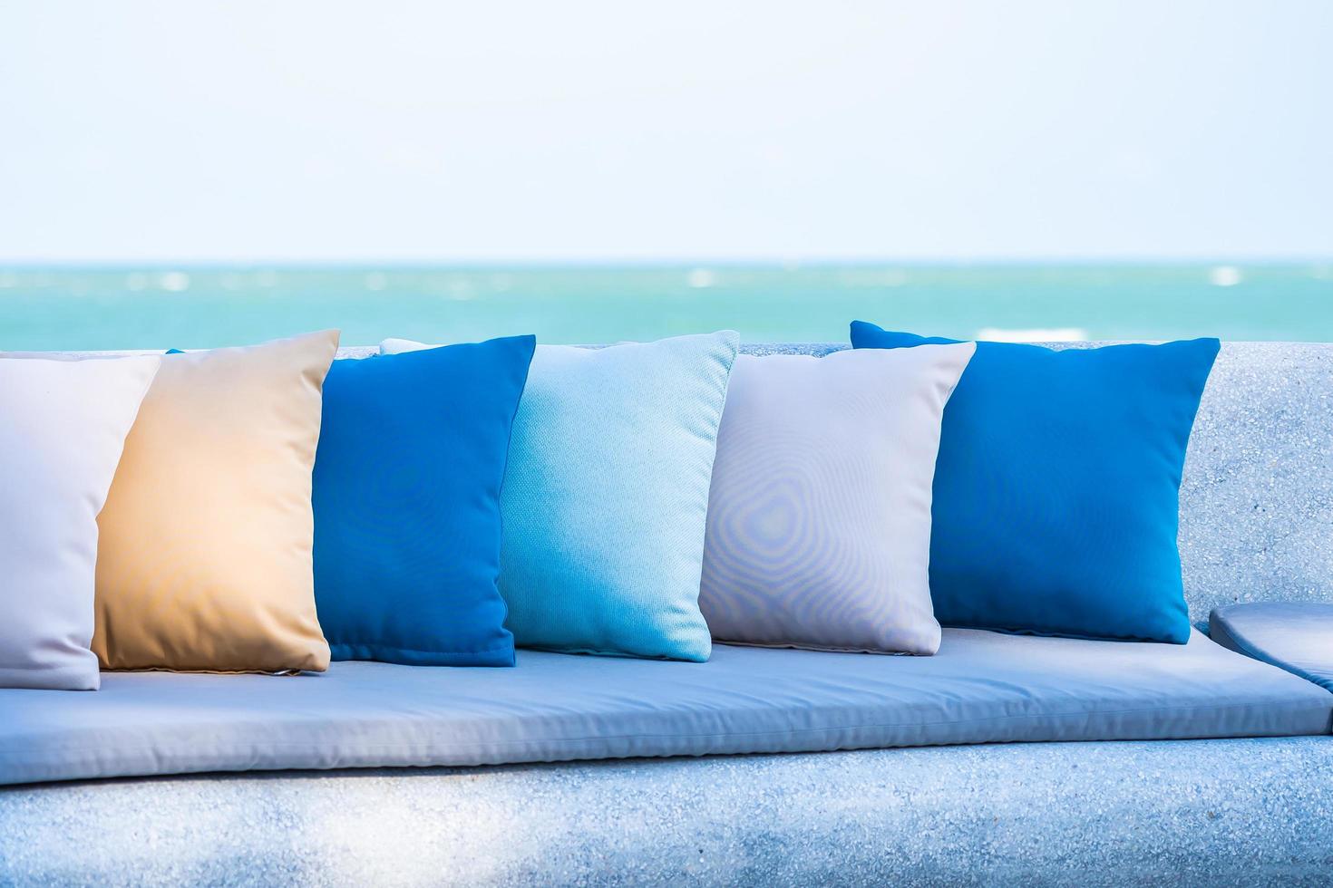 Pillows on sofa with sea ocean beach view photo
