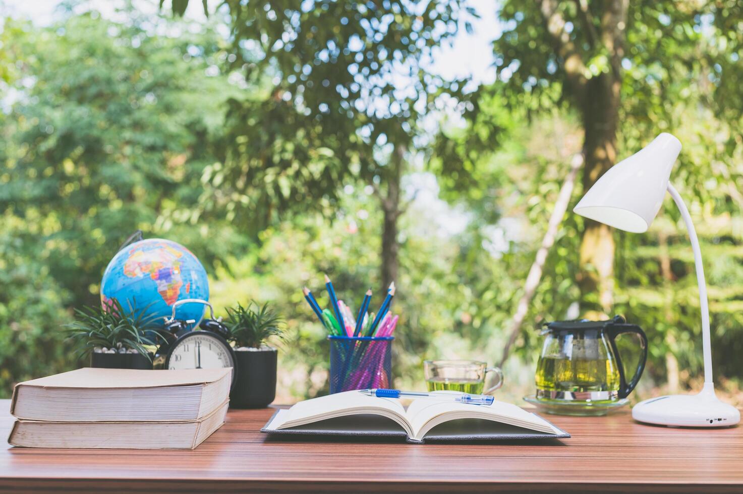 Books on the desk, nature background photo