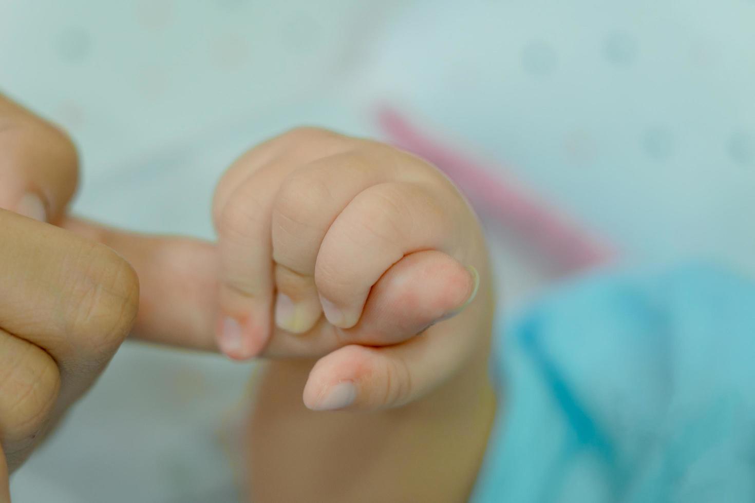 Hand of a sleeping baby photo