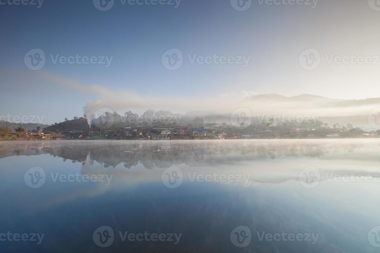Foggy village landscape photo