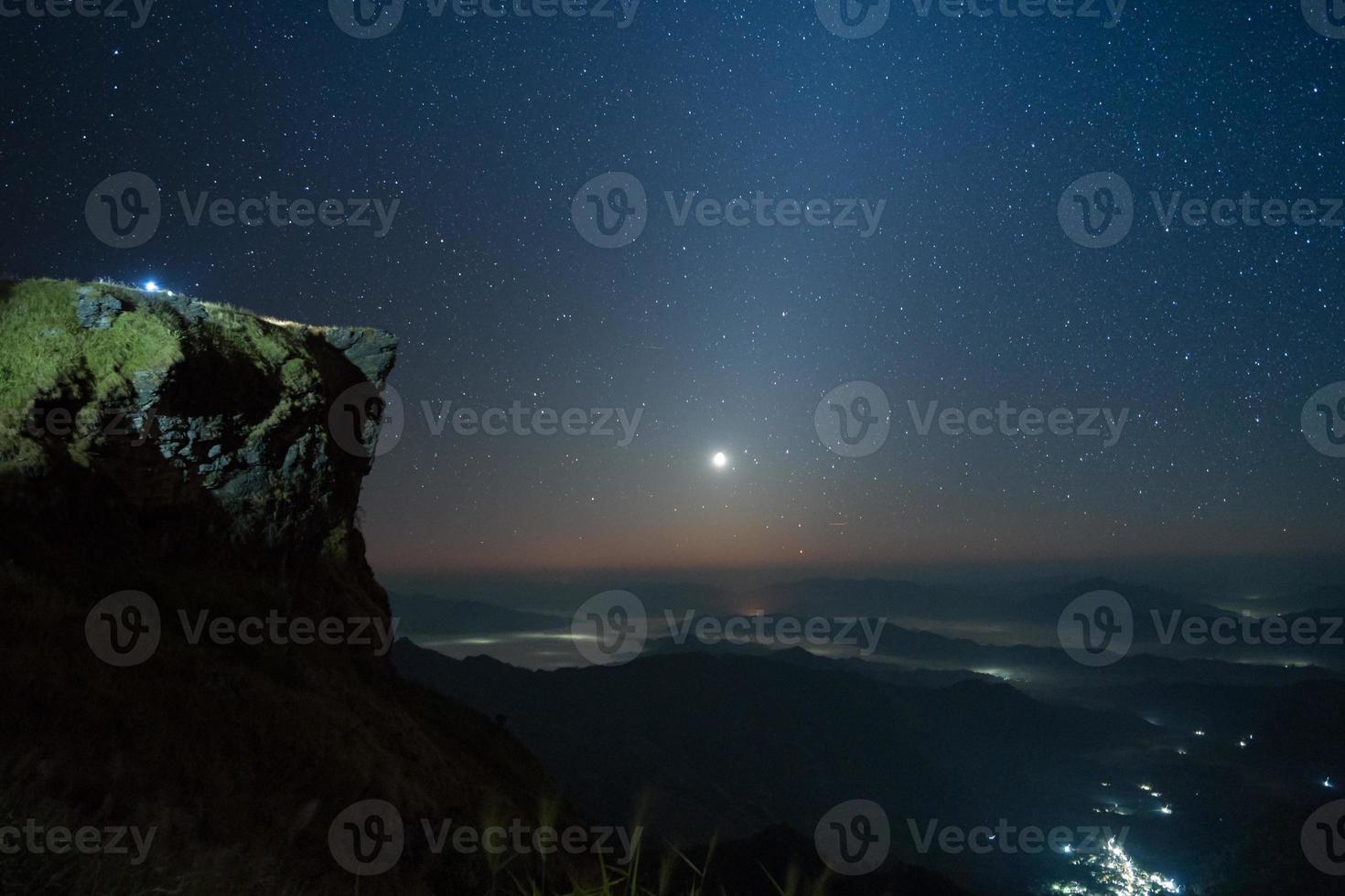 Cliff and starry sky photo