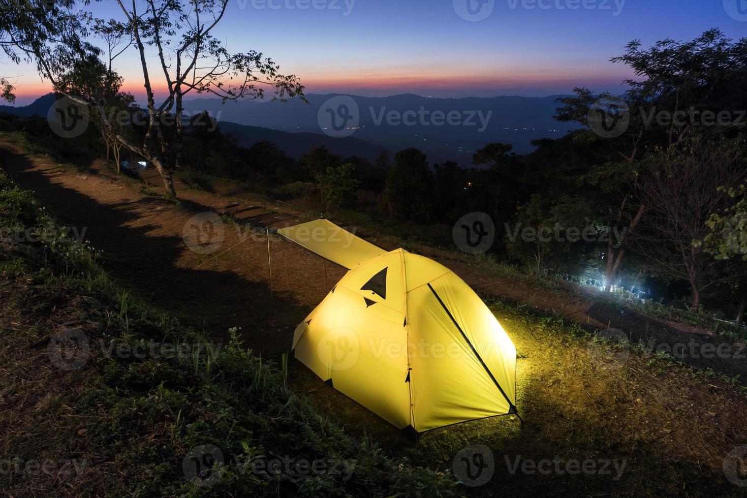 Camping tent on a mountain side photo