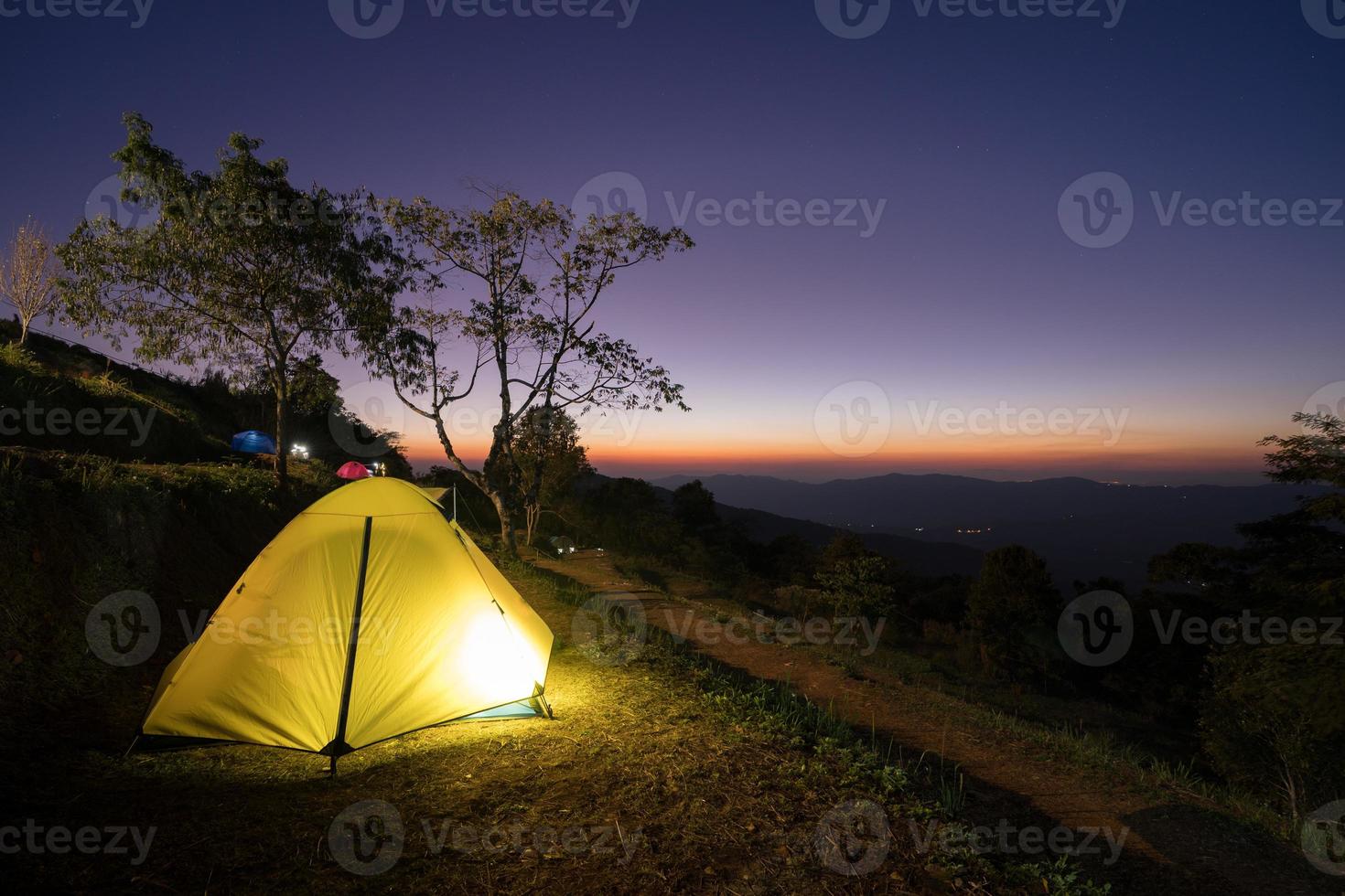 Glowing tent at sunset photo