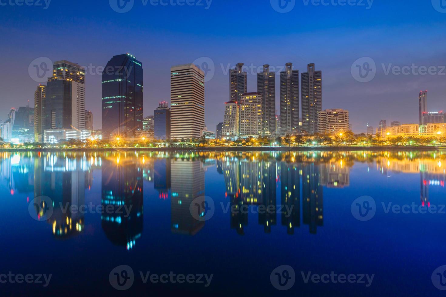 Cityscape view of building reflections in water photo