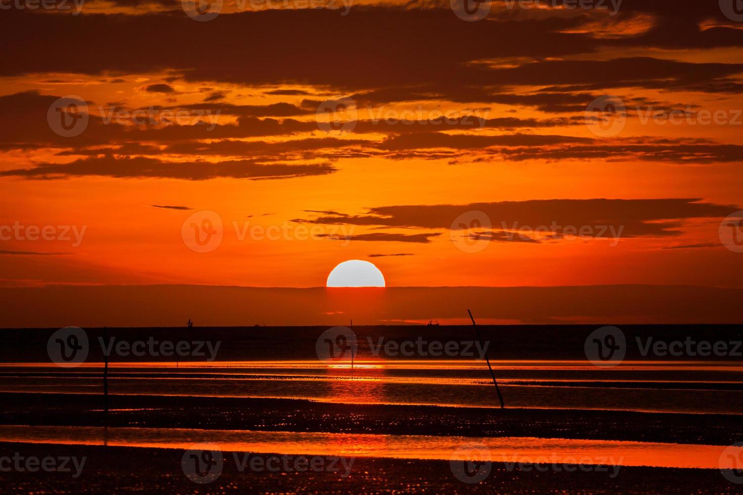 Red sunset at the beach photo