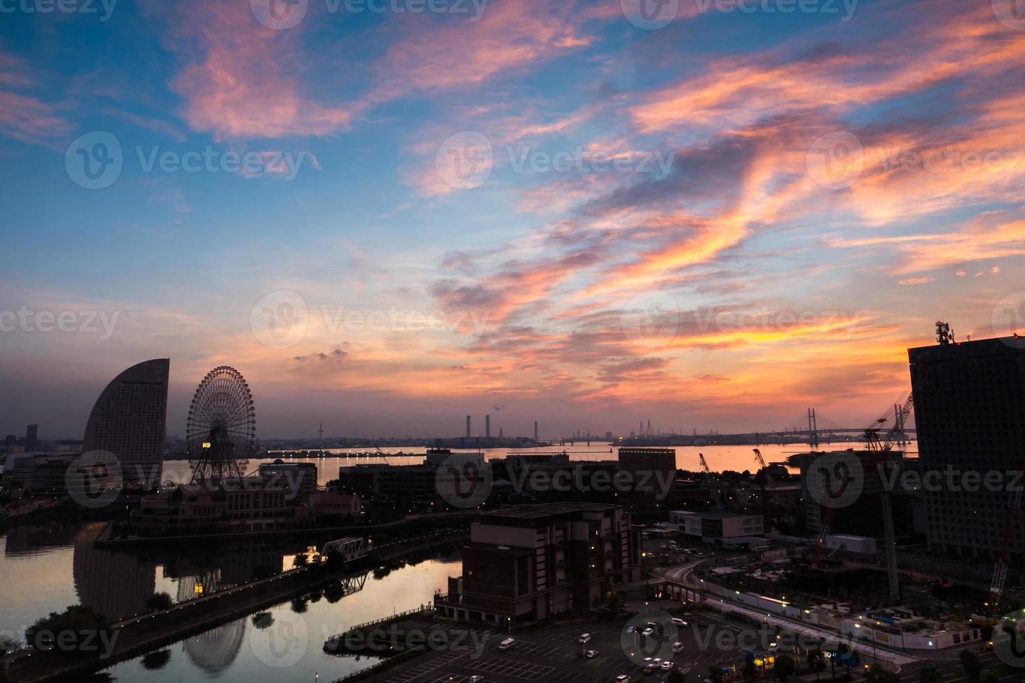 Silhouette of a city at sunset photo