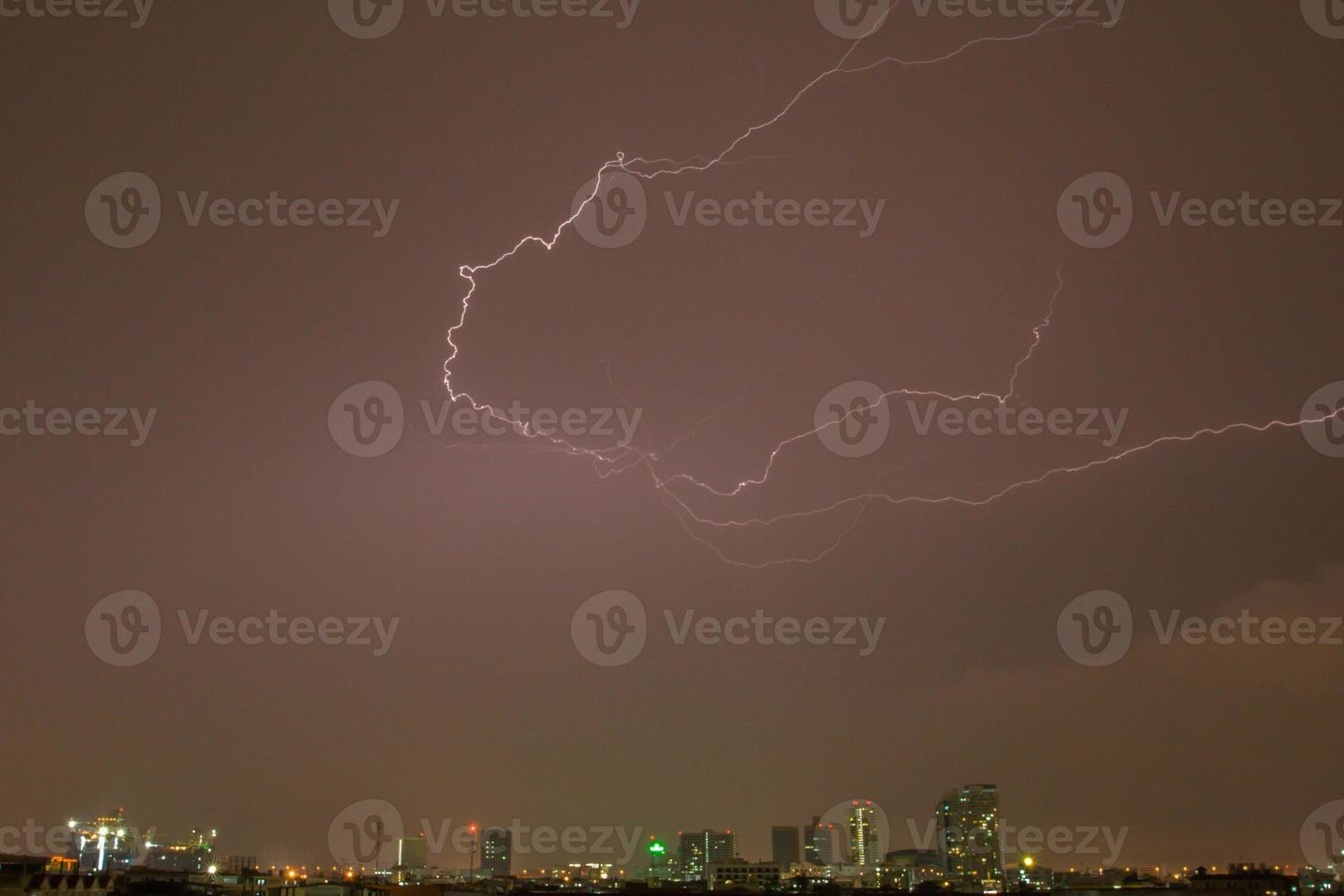 Lightening over a city photo