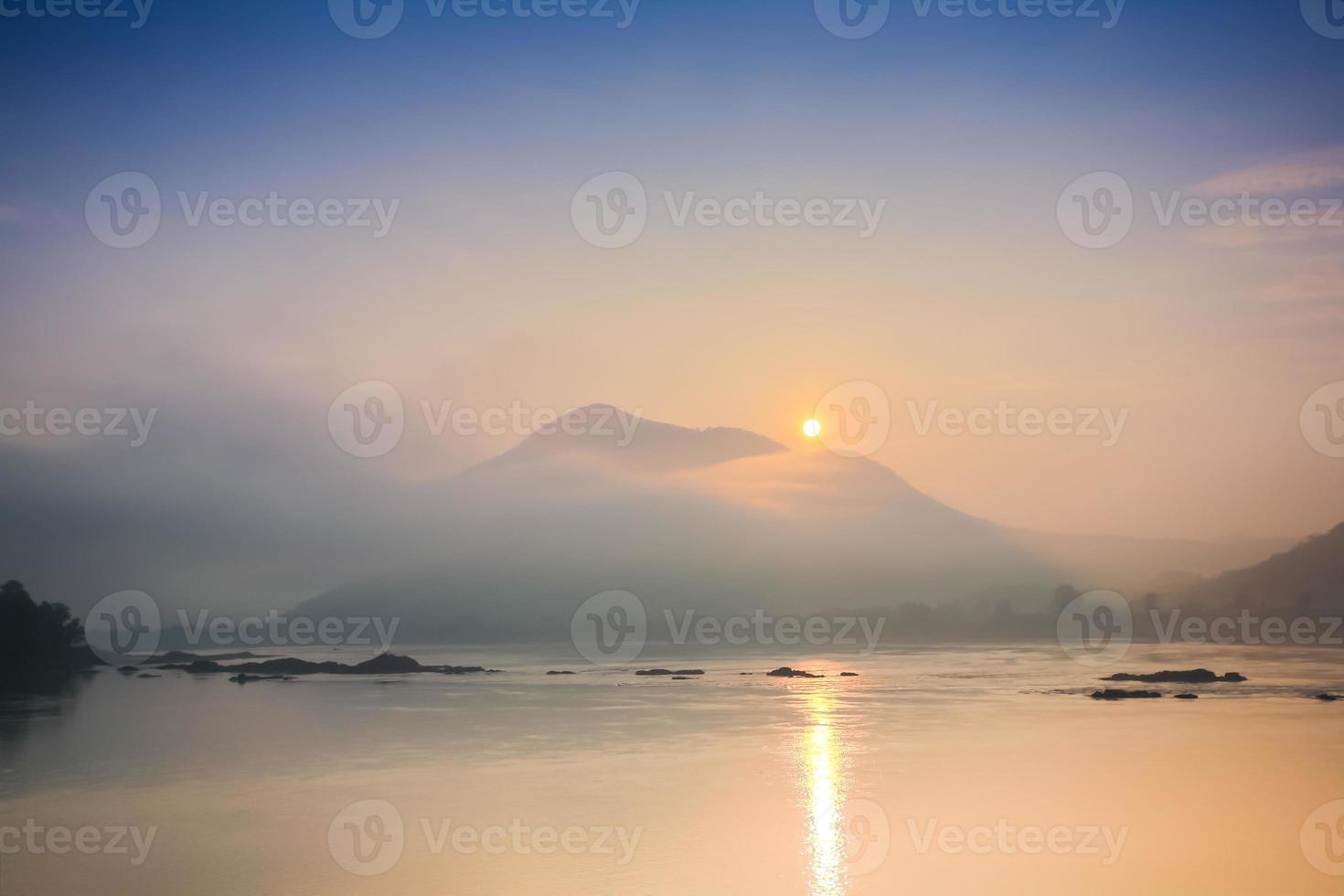 Sunrise over mountains and the ocean photo