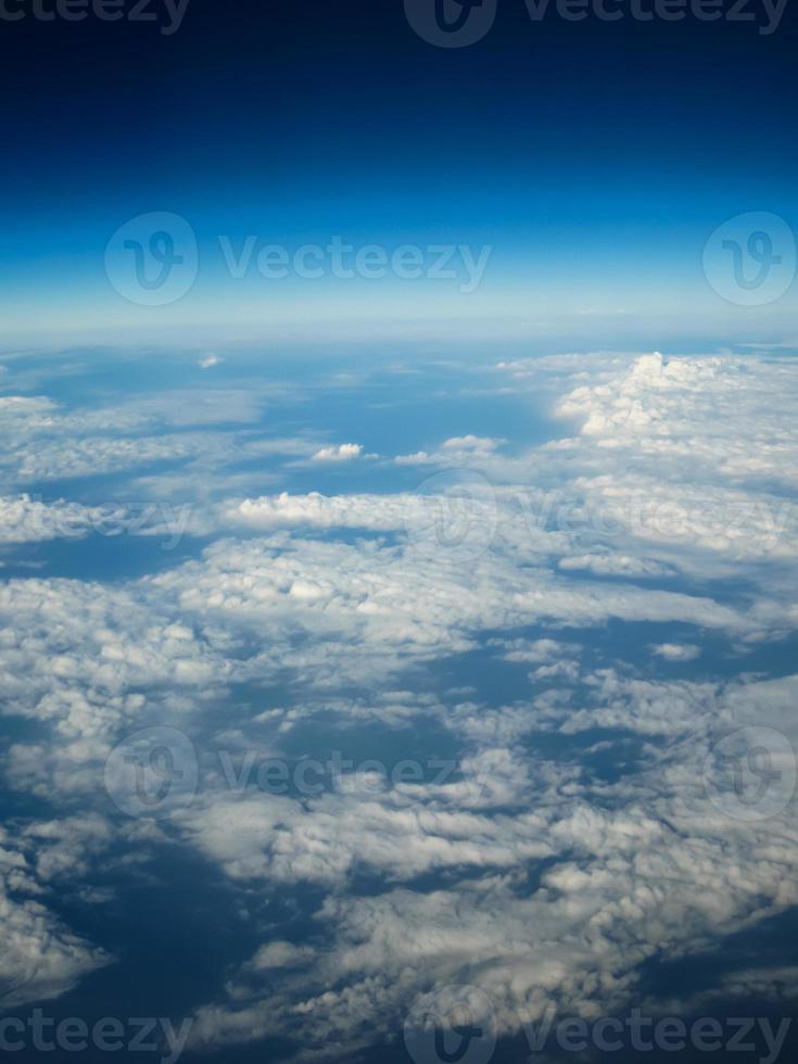 Aerial view of clouds and land photo