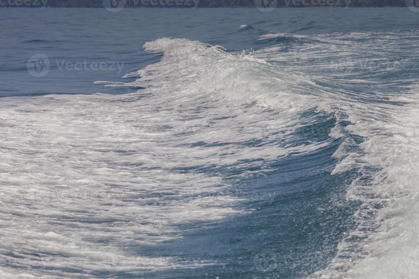 White waves and blue ocean photo