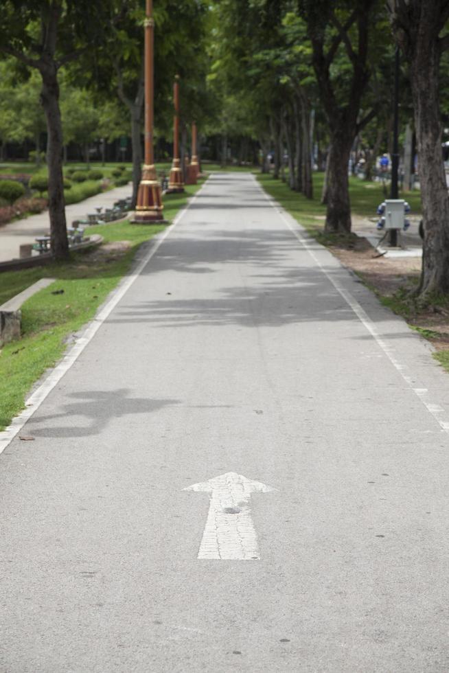 Painted arrow on the road photo