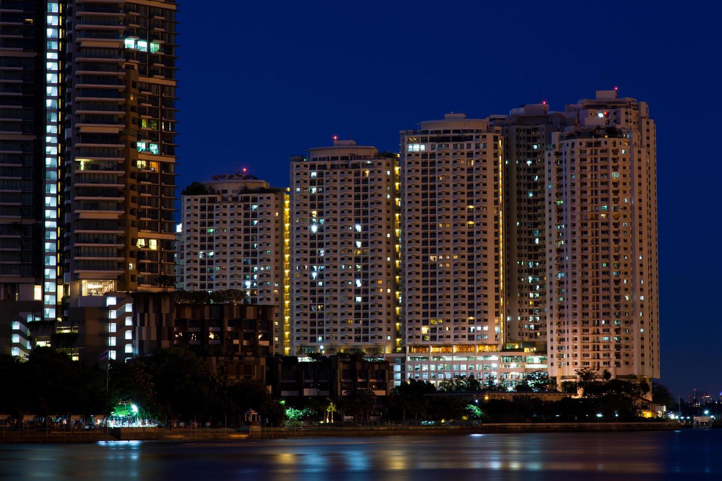 Condominiums and skyscrapers at night photo