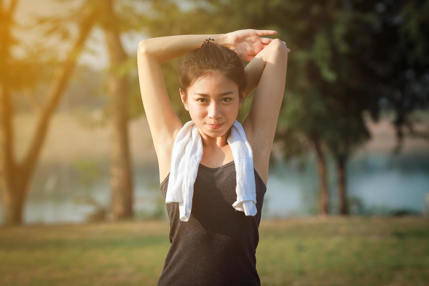 Athletic woman warming up photo