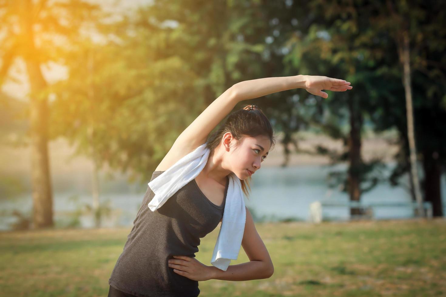 Athletic woman warming up photo