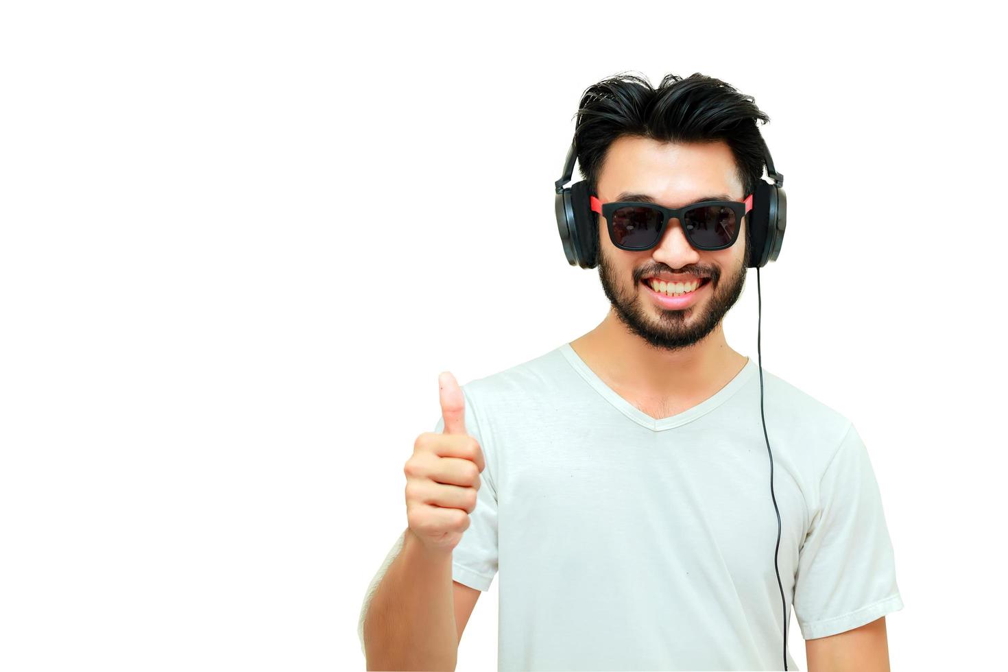 Asian man wearing headphones on white background photo