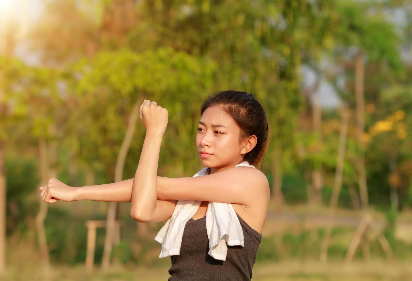 Athletic woman warming up photo