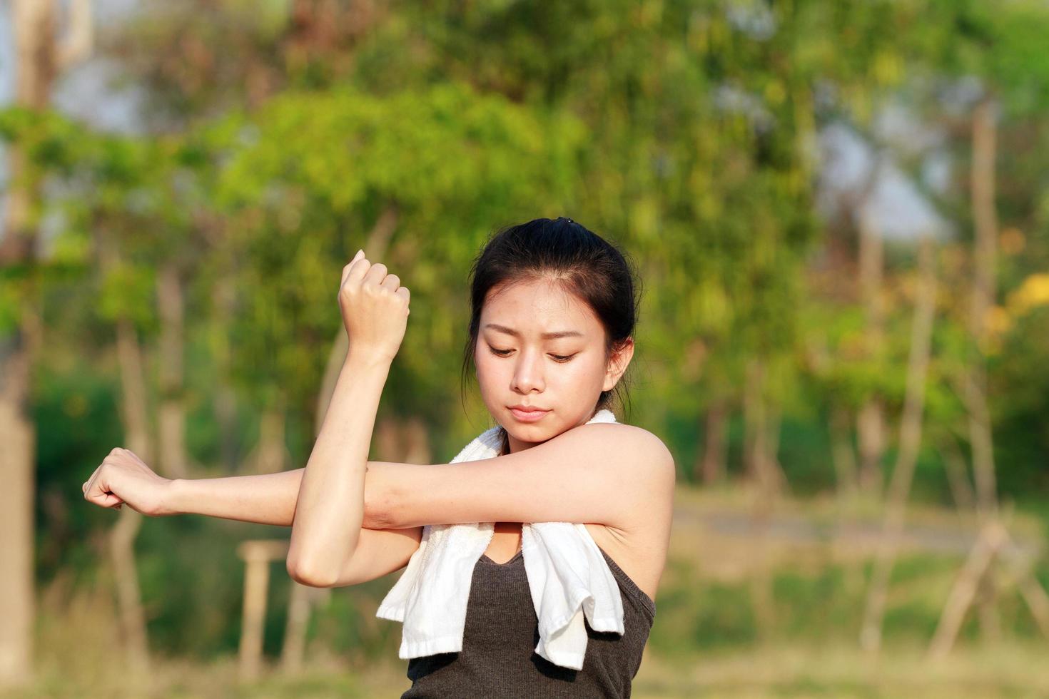 Athletic woman warming up photo