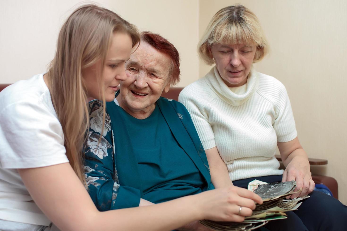 Grandmother, mother, and daughter bonding photo