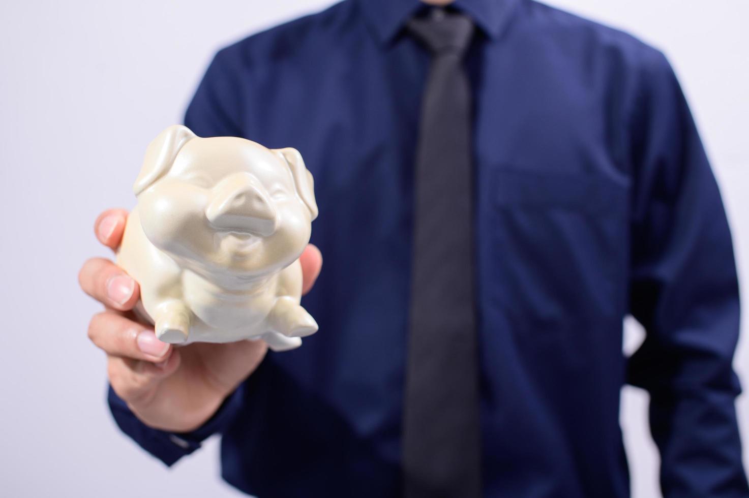 Man holding piggy bank photo