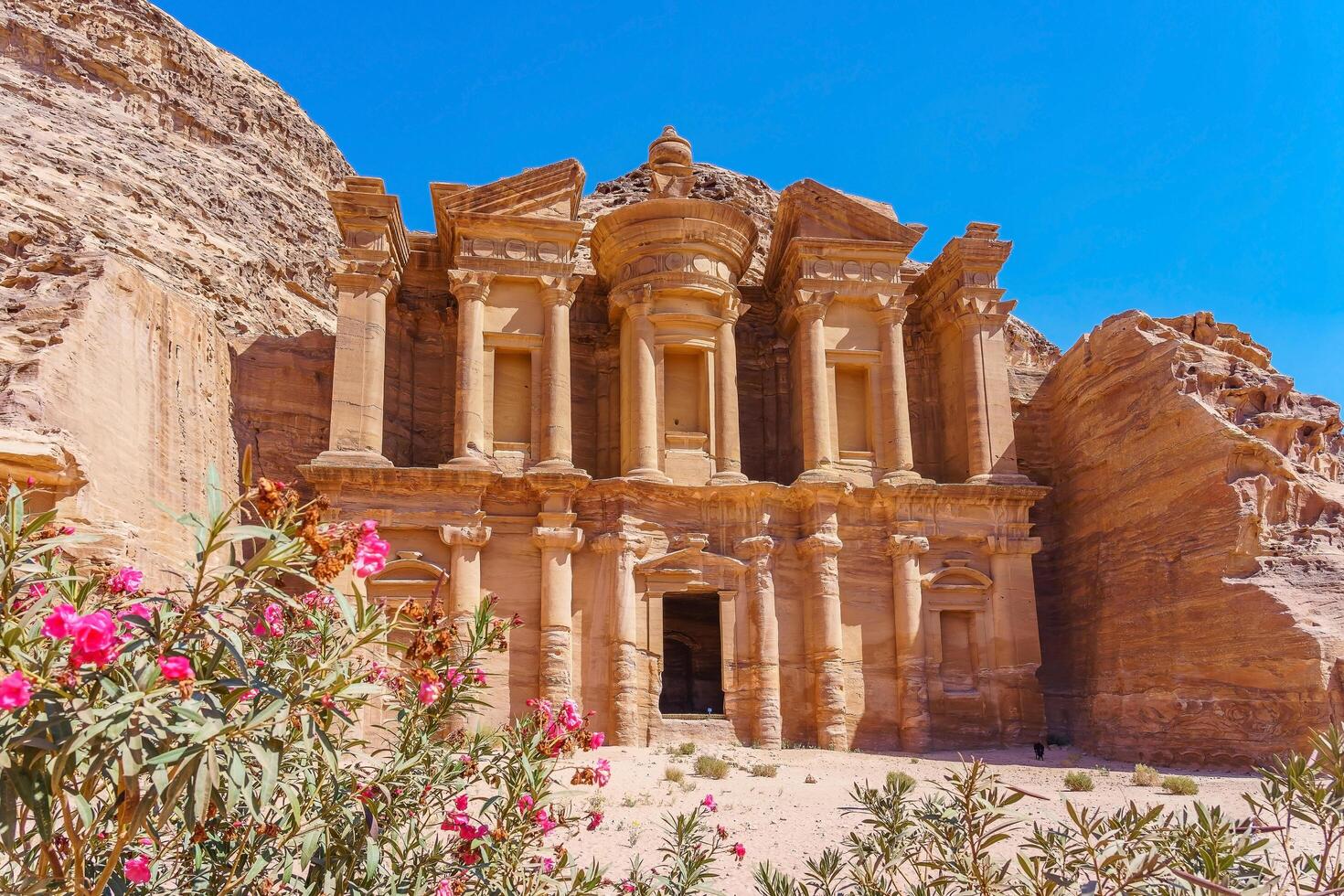 Famous facade of the Ad Deir in the ancient city of Petra, Jordan photo