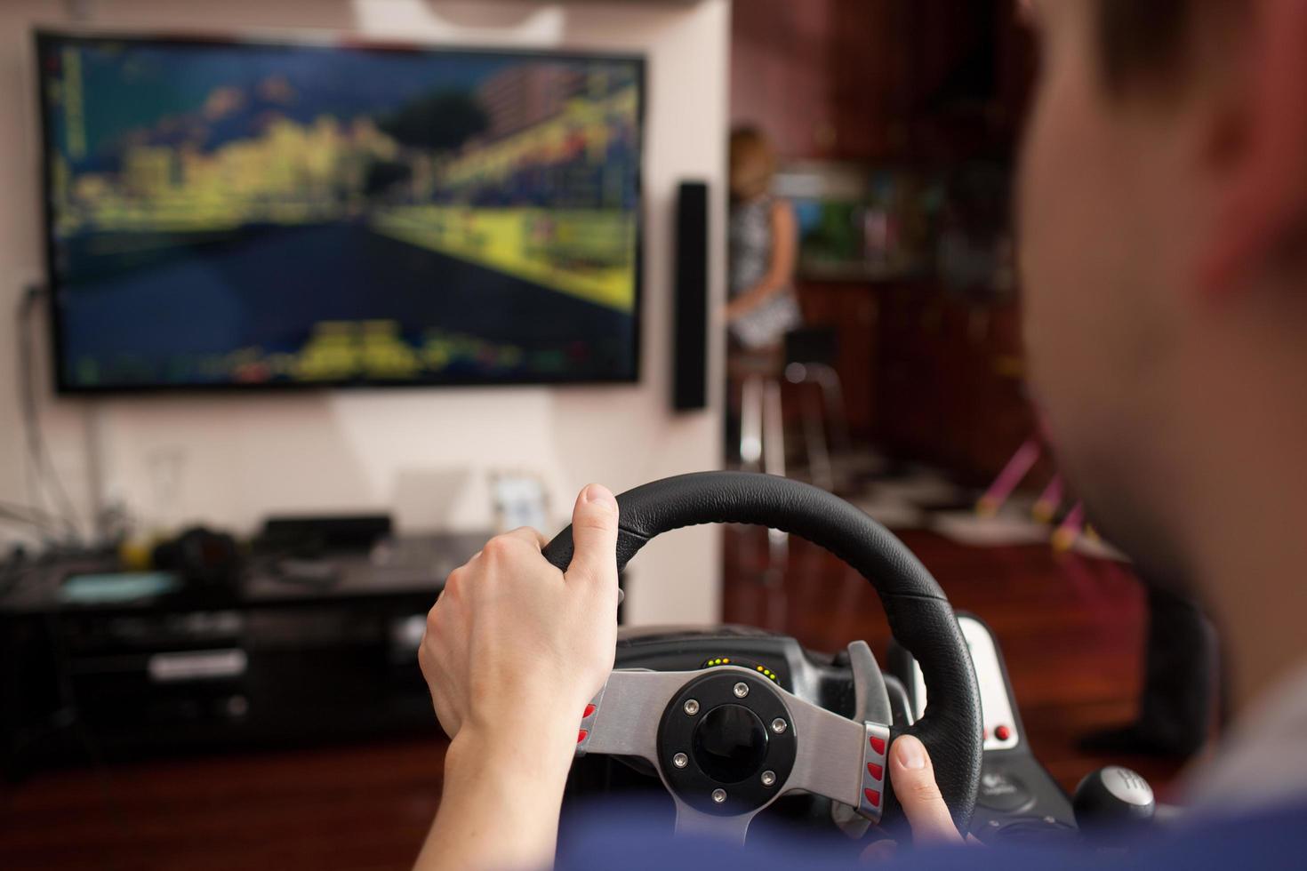 Man playing racing game photo