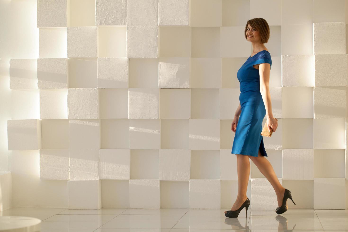 Smiling woman in blue dress photo