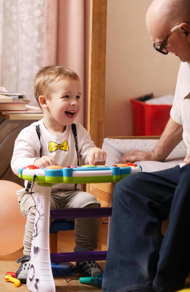 Candid portrait of a grandson and grandfather photo