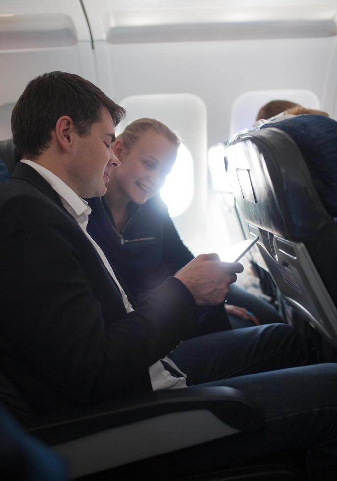 Couple on an airplane photo