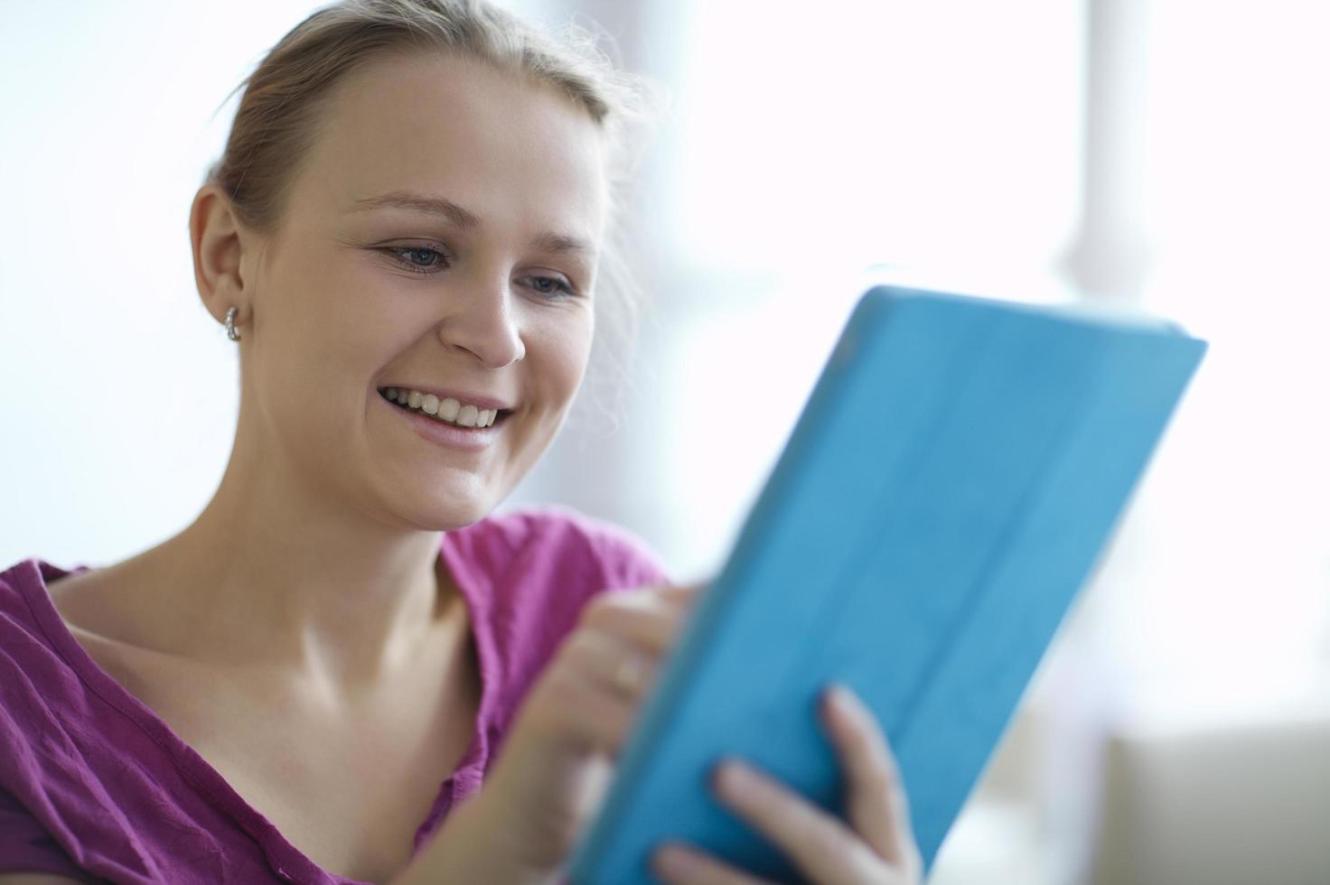 Woman holding a tablet photo