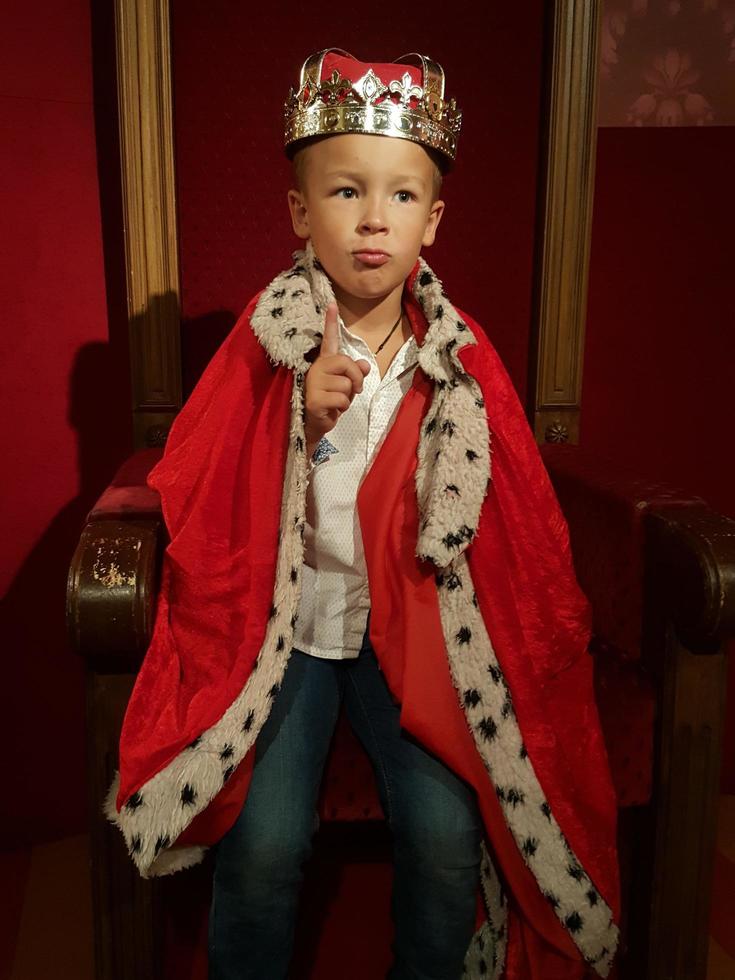 Boy dressed as a king photo