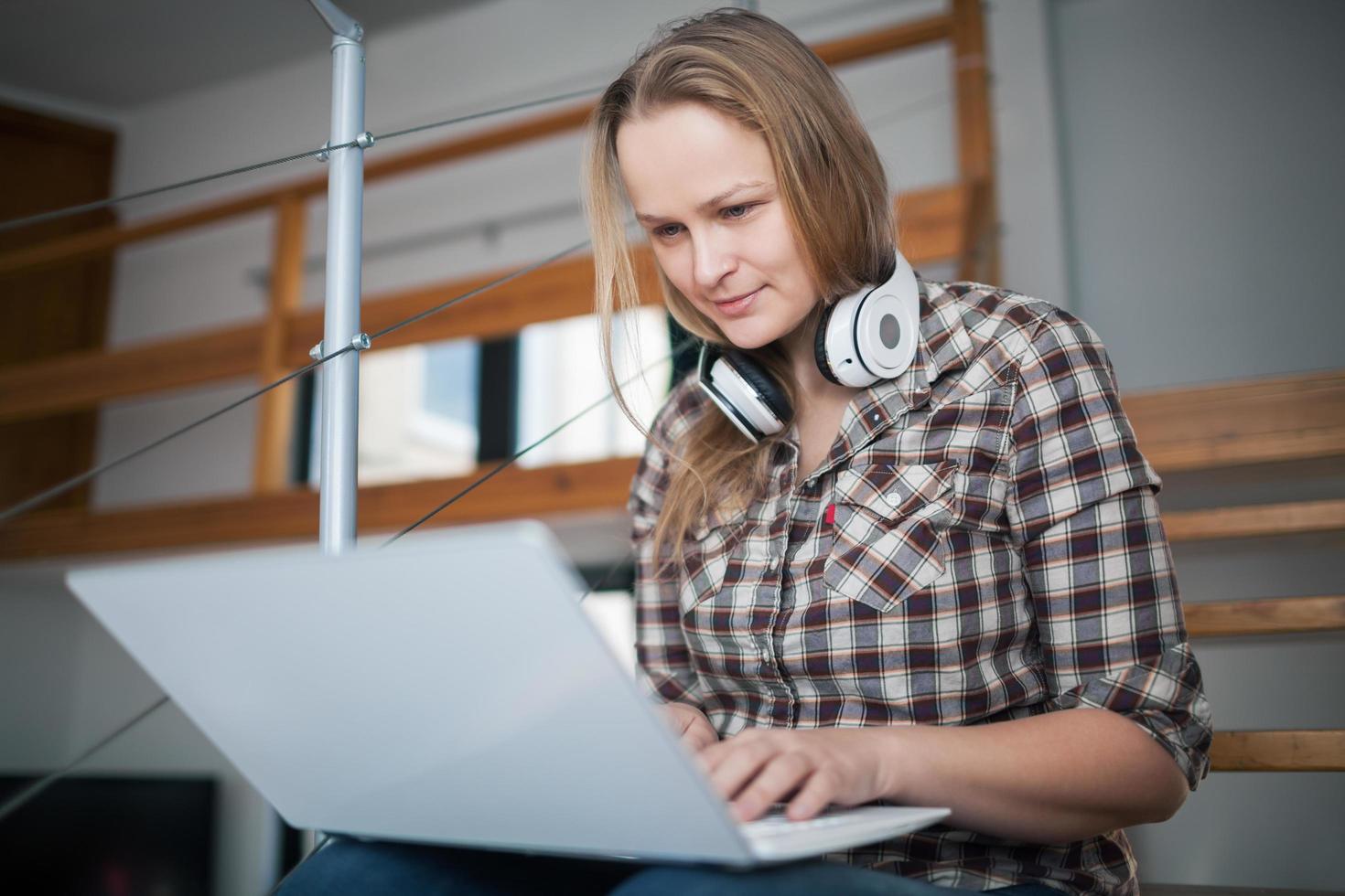 Woman relaxing with a laptop photo