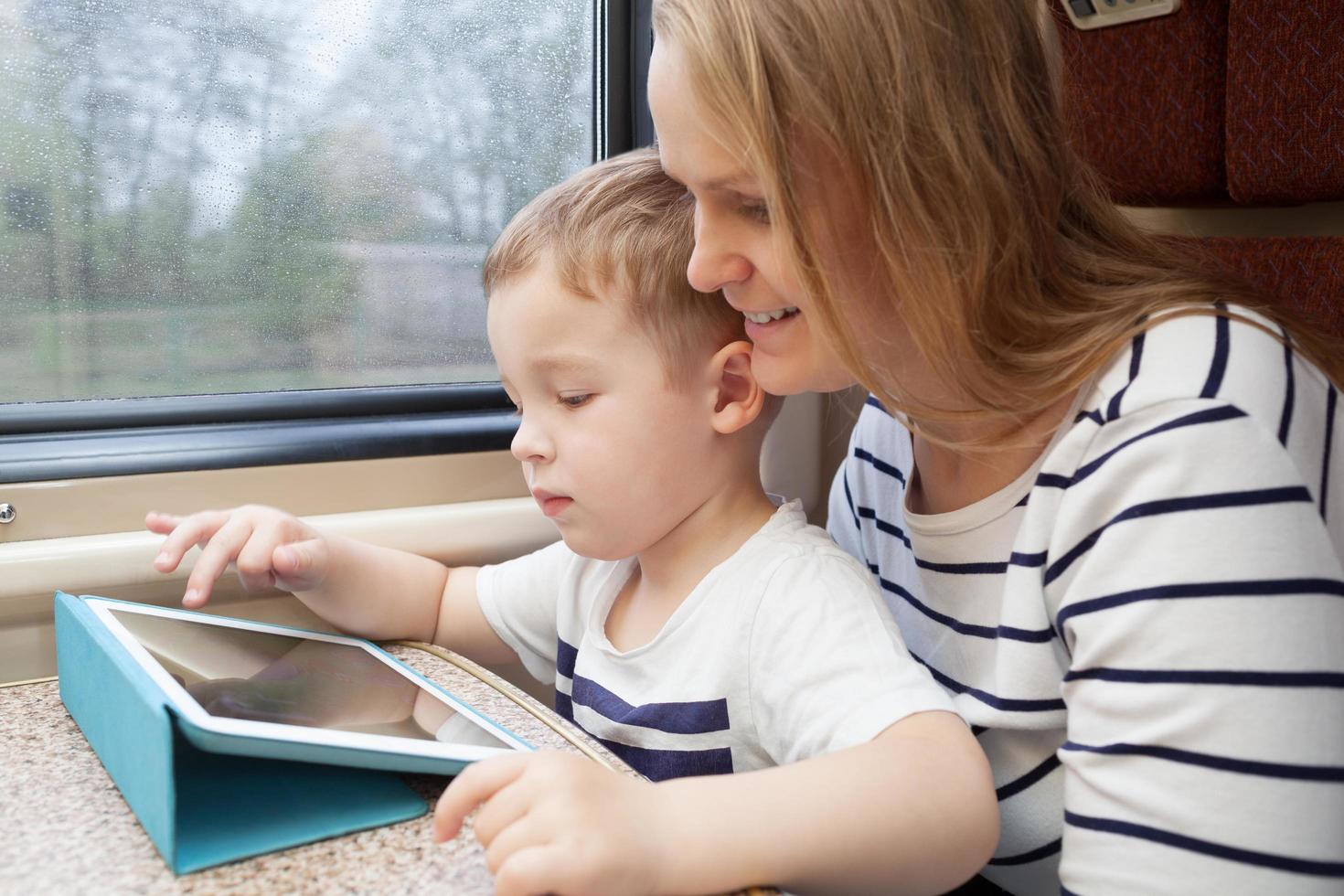 Mother and son using a tablet photo