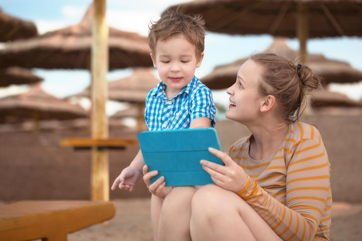 Boy and mother using a tablet photo