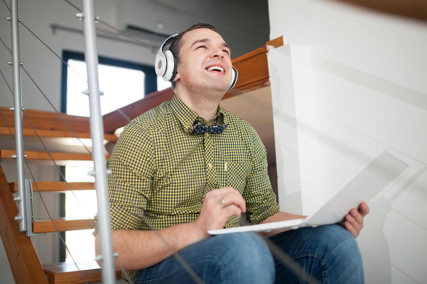 Young man listening to music photo