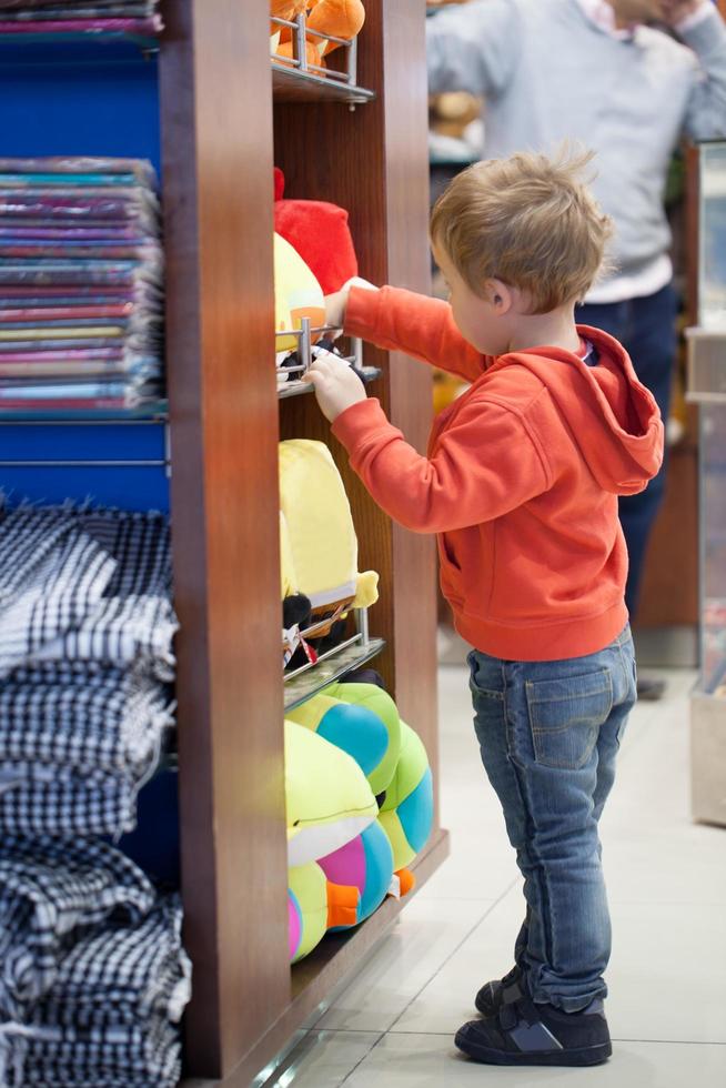 Boy shopping for beach accessories photo