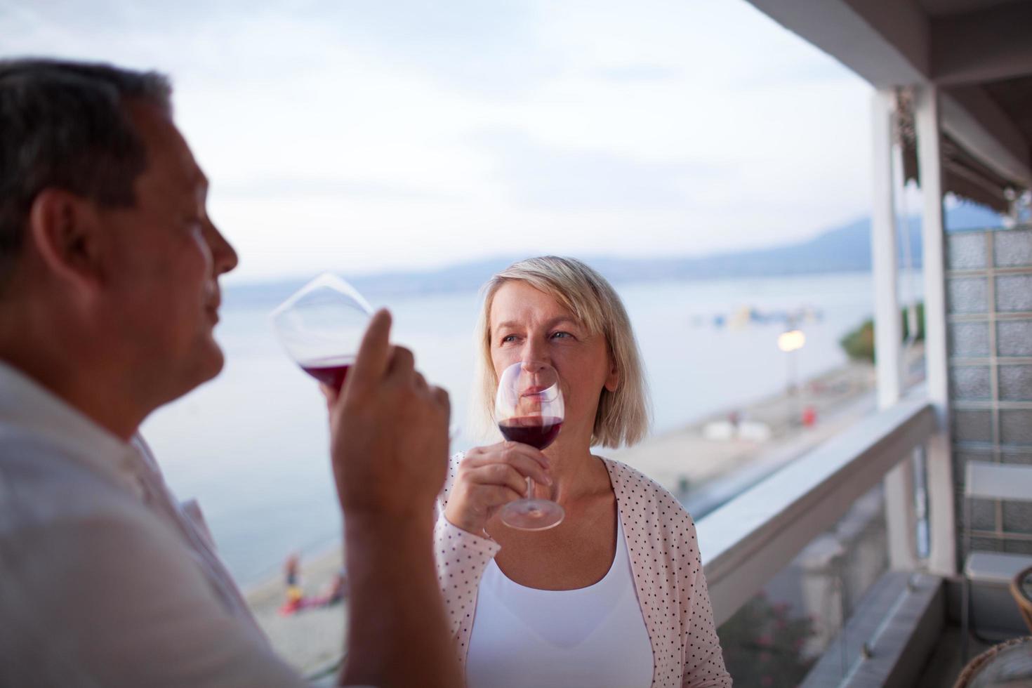 Mature couple drinking wine photo