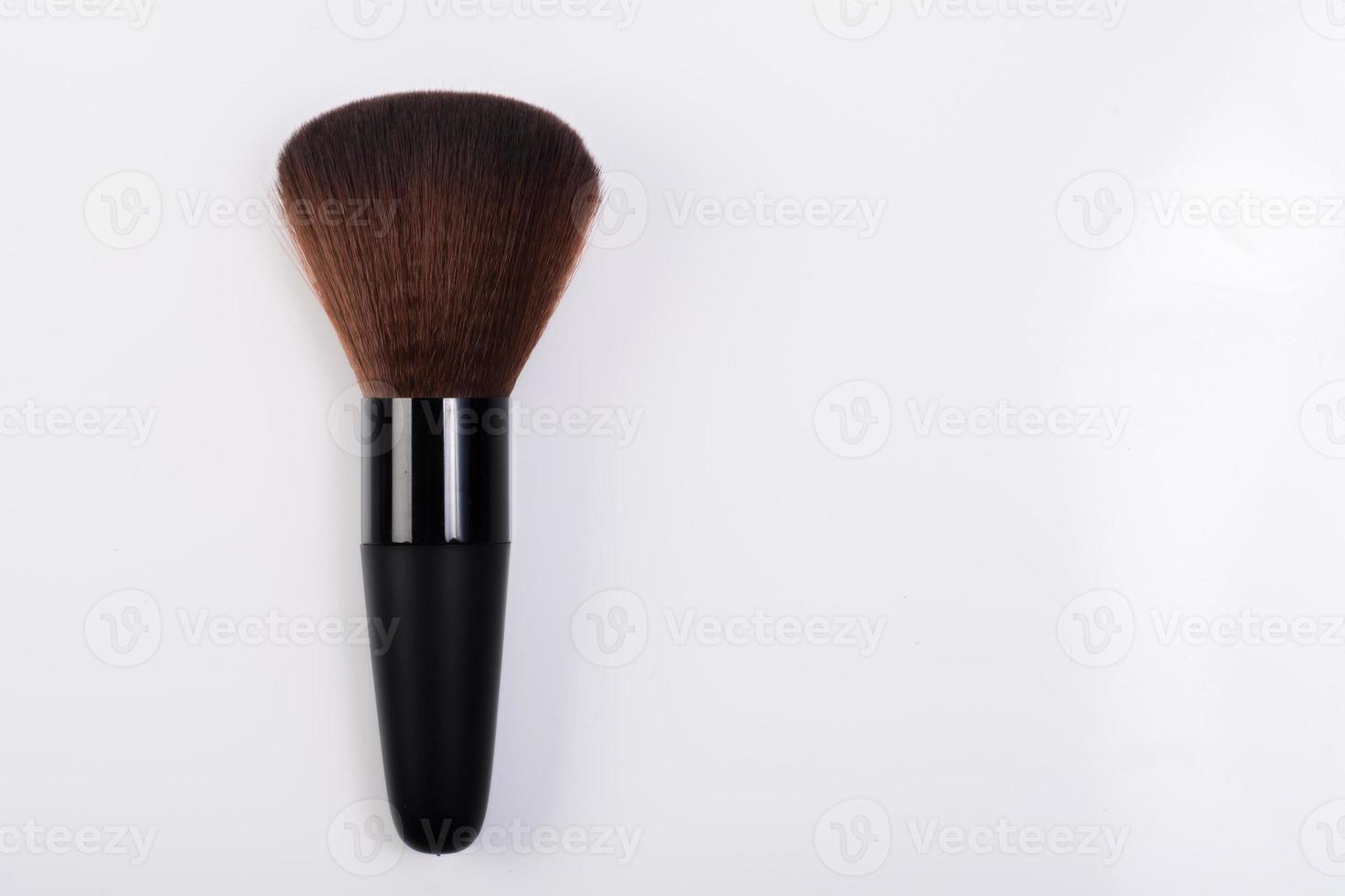 Close-up of makeup brush on white background photo