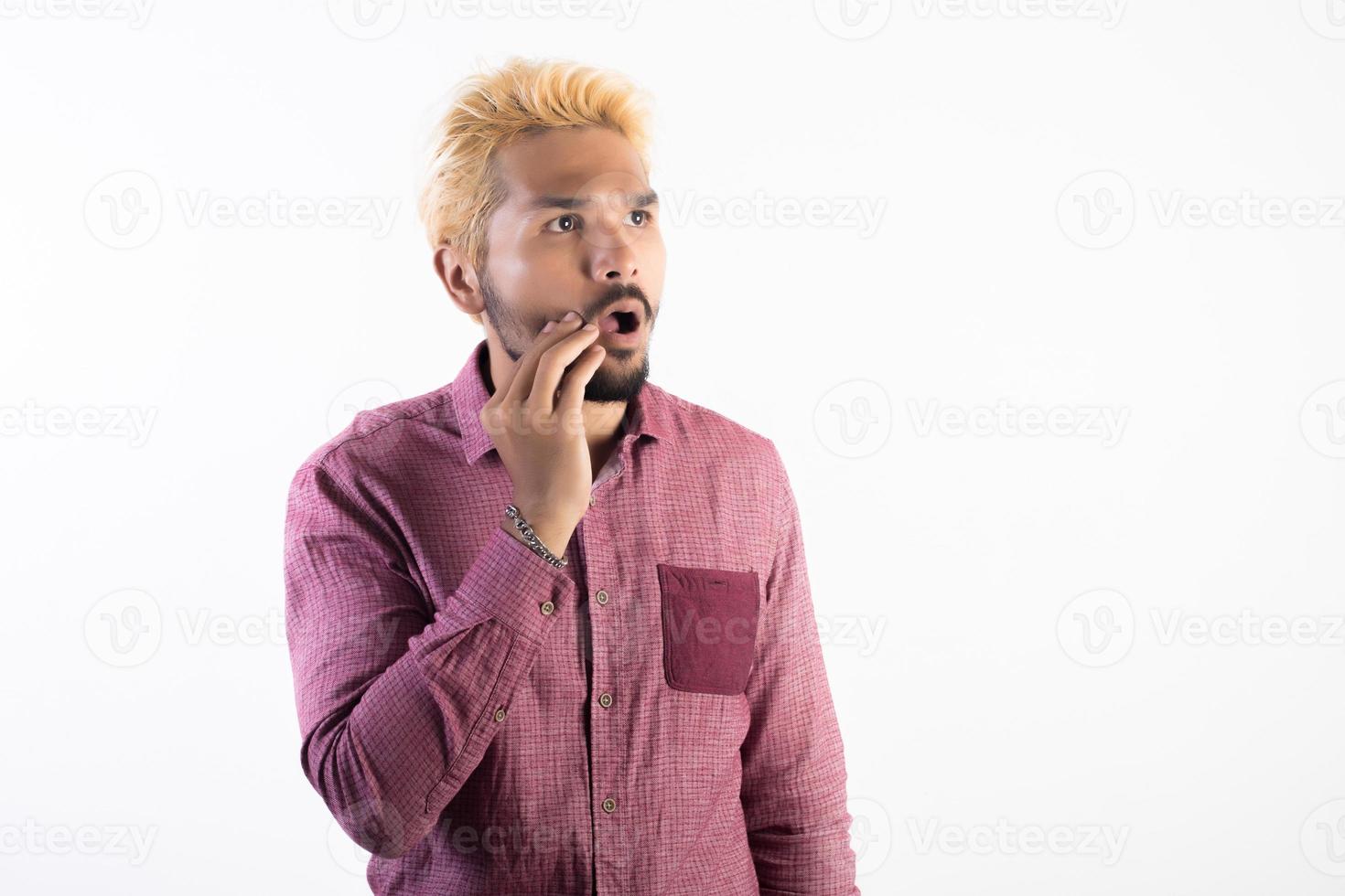 Portrait of a handsome hipster man standing isolated on white background photo