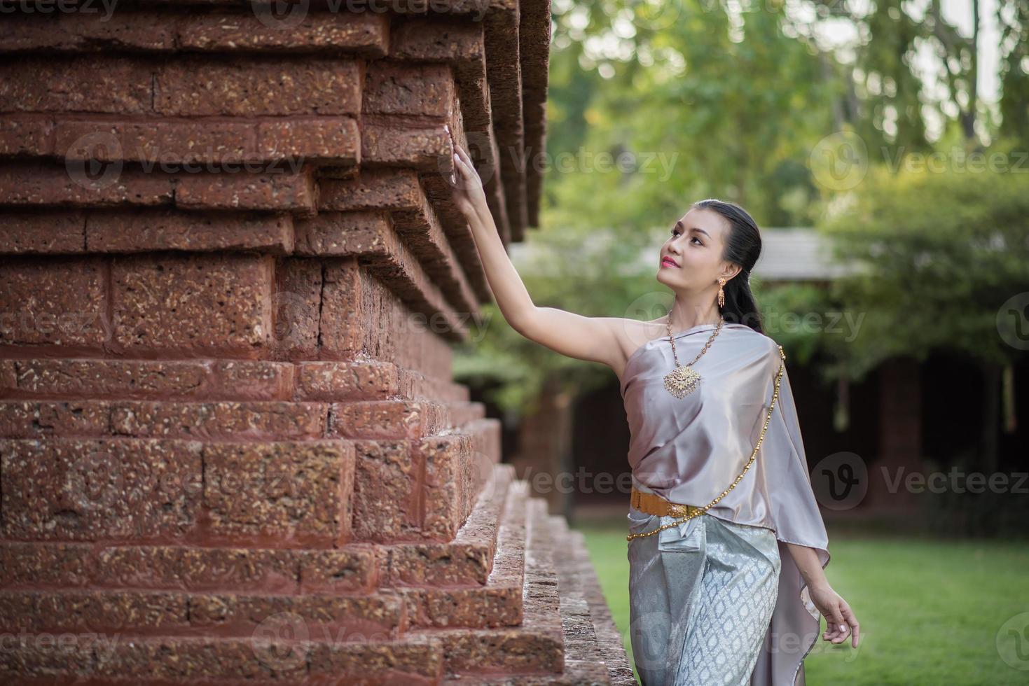 Beautiful woman wearing a typical Thai dress photo