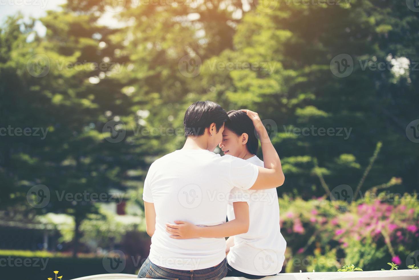 Smiling young couple in love outdoors photo